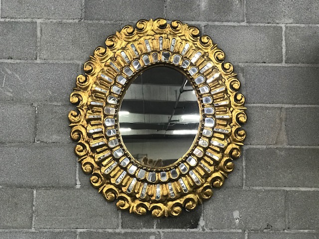 Golden decorative wall mirror.