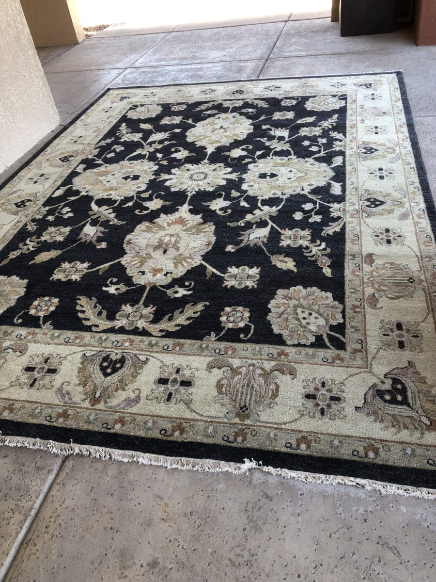 black and tan floor rug