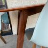 Modern Dining Table with Shell Chairs detail