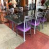 Set of 8 Iron Dining Chairs at table