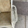 White Wicker Rocker with Magazine Holder Armrest