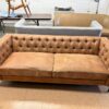 camel color tufted sofa